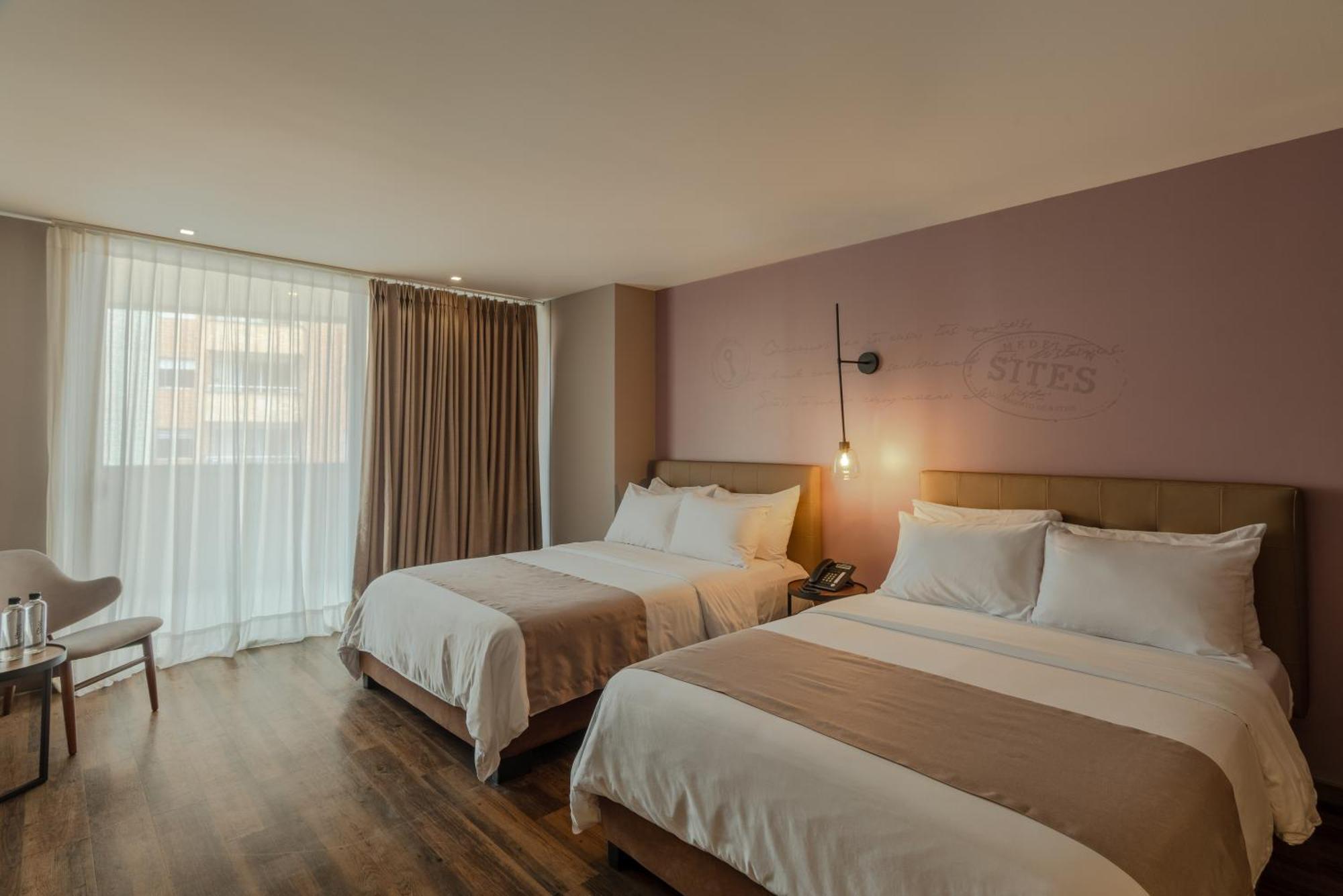 فندق سايتس ميديلين المظهر الخارجي الصورة A room at the hotel